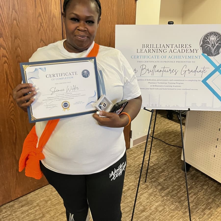 A Brilliantaires graduate celebrating with her certificate